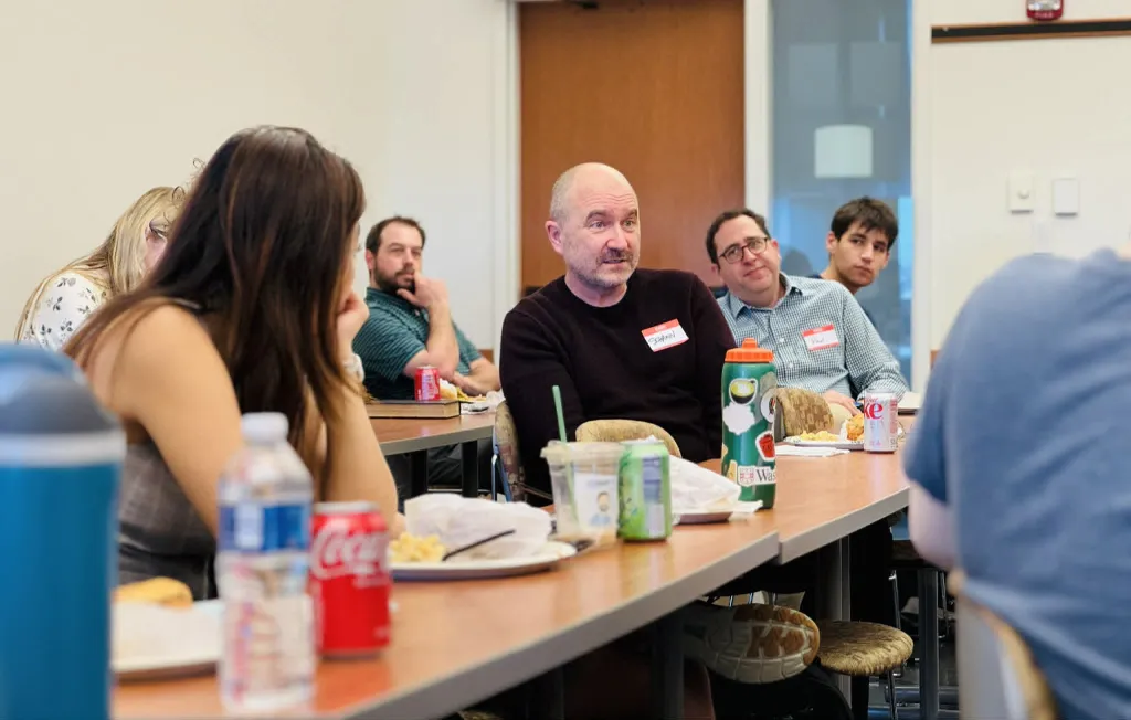 Guest Schawn Belston (center) and FMS donor Paul Engelberg (center-right) during a lunch session