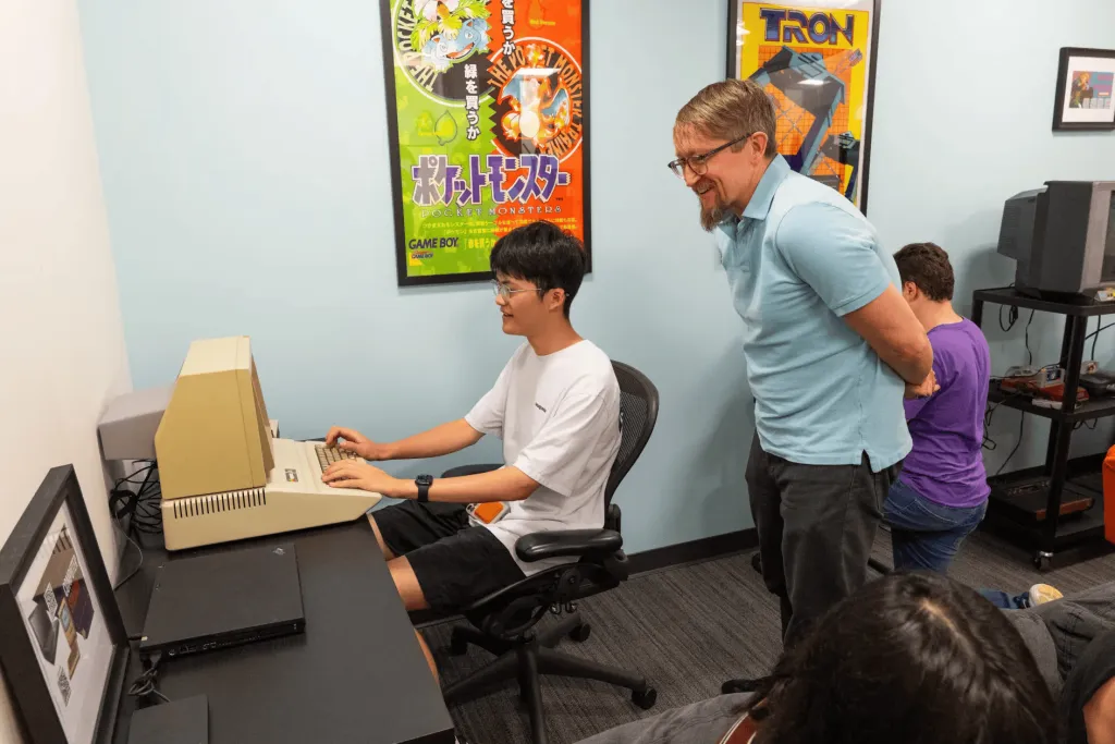 WashU students explore vintage video games with James Fleury at the Interactive Archive in Seigle Hall.